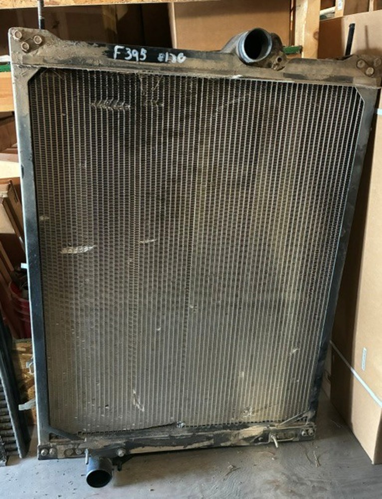 USED JOHN DEERE RADIATOR - RE242256